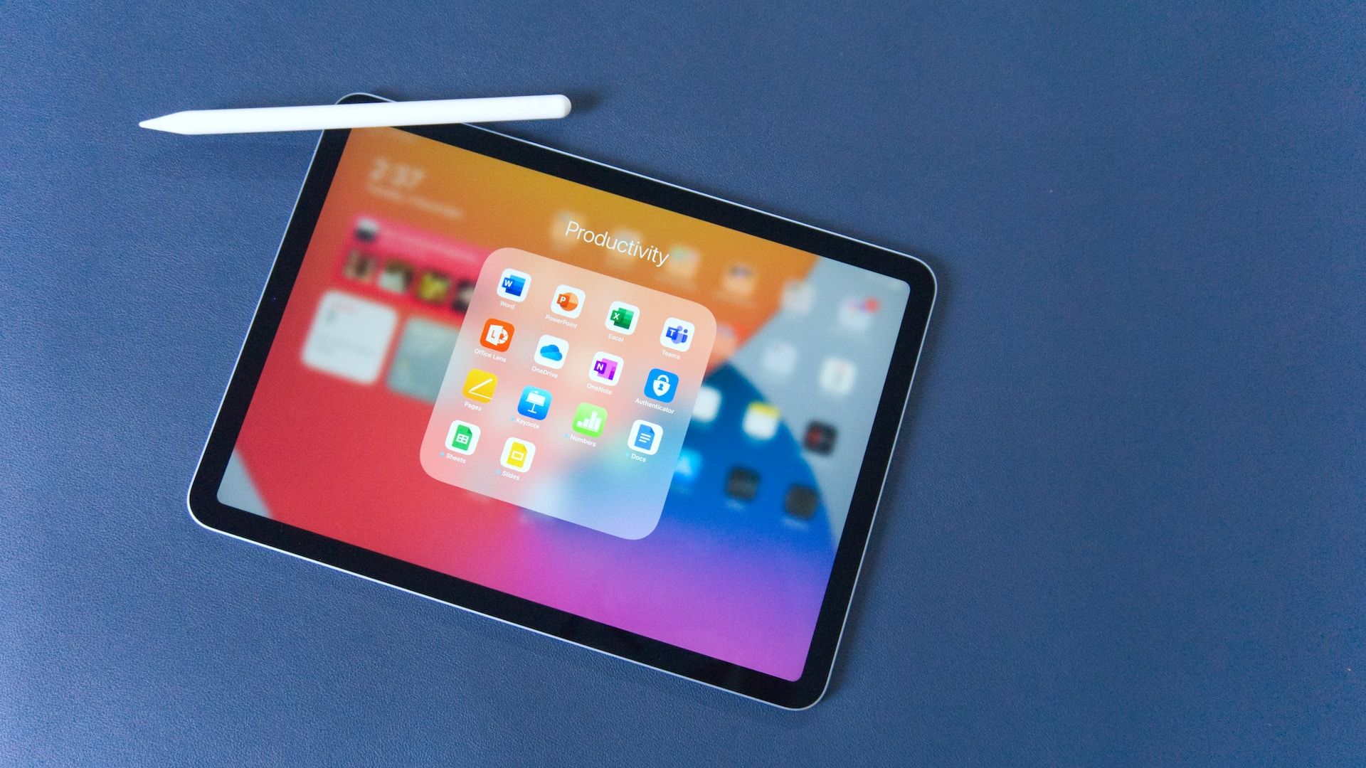 An iPad on a blue surface